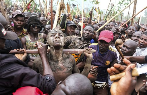 A mass circumcision is marketed to tourists in a remote area of Uganda